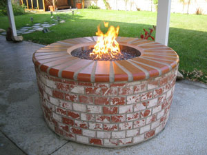 Brick fire pit with fireglass